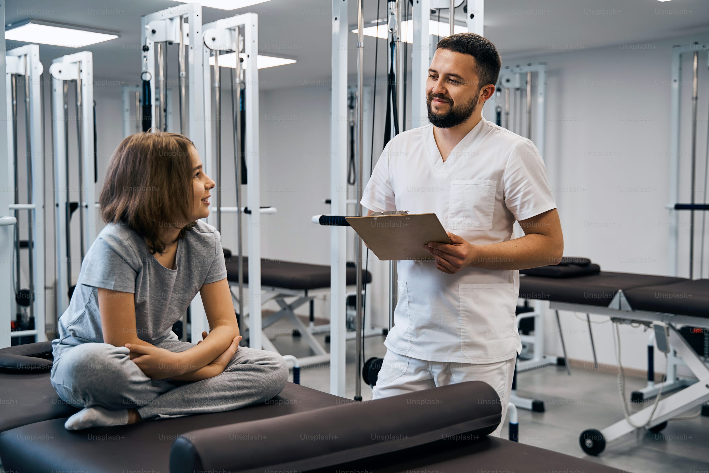 Physical therapist working with patient during rehabilitation